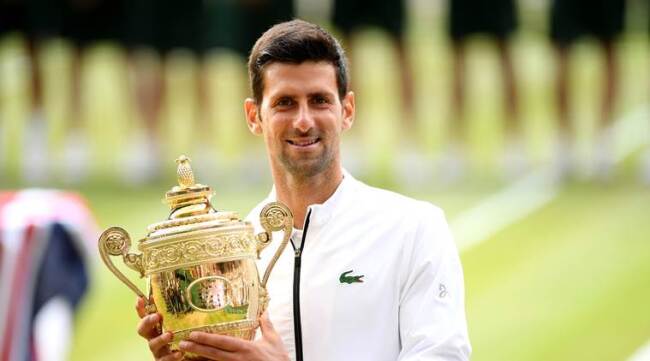Novak Djokovic with Wimbledon trophy