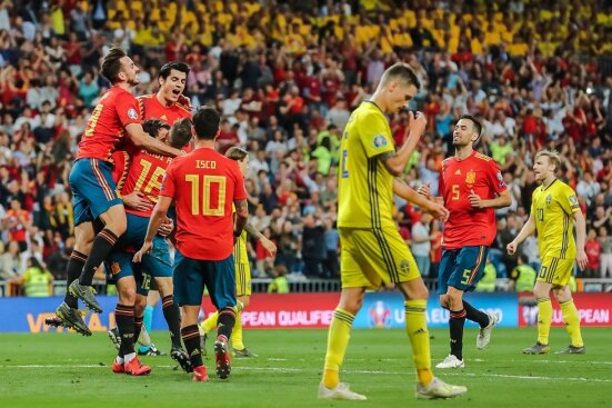 Spain celebrating a goal against Sweden