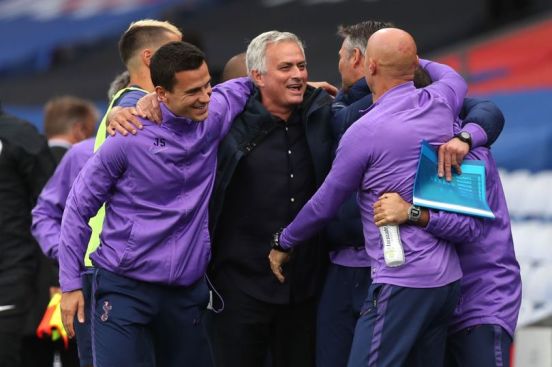 Jose celebrating with his staff at Spurs