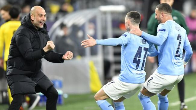 Pep Guardiola celebrating Phil Foden's goal