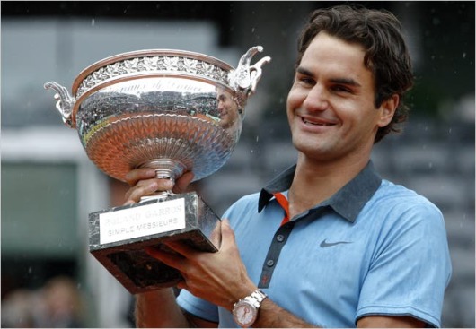 Federer is all smiles after lifting the 2009 French Open