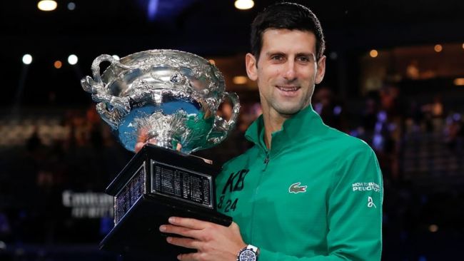 Djokovic lifting the 2020 Australian Open Trophy