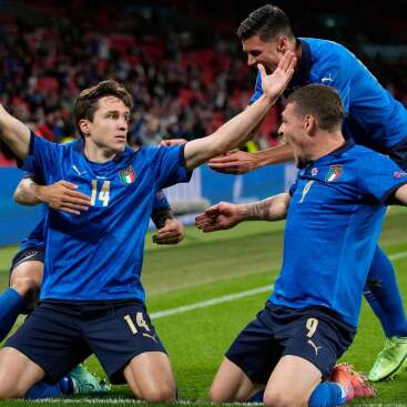 Chiesa celebrating after scoring against Austria