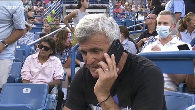 Apostolos Tsitsipas, father of Stefanos Tsitsipas talking on his mobile phone