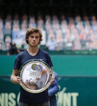 Rublev poses with his silverware after finishing as the runner-up in the ATP-500 Halle Open