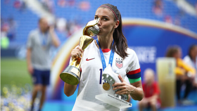 Alex Morgan with the silver boot trophy