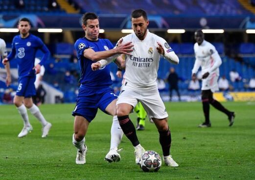 Eden Hazard being marshalled by Cesar Azpilicueta