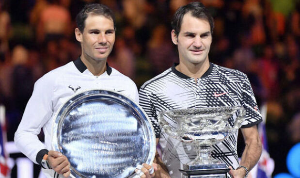 Federer and Nadal pose with their silverware after the finals of the Australian Open 2017